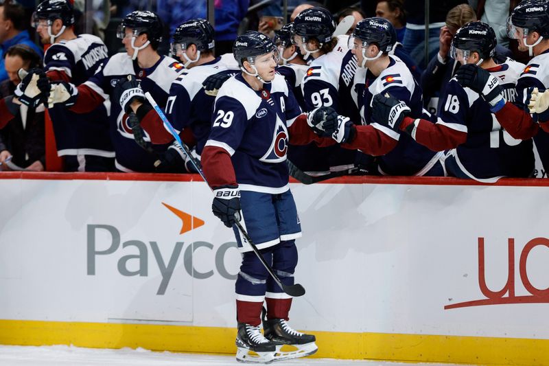 Dec 31, 2025; Denver, Colorado, USA; Colorado Avalanche center Nathan MacKinnon (29) celebrates with the bench after his second goal in the first period against the St. Louis Blues at Ball Arena. Mandatory Credit: Isaiah J. Downing-Imagn Images