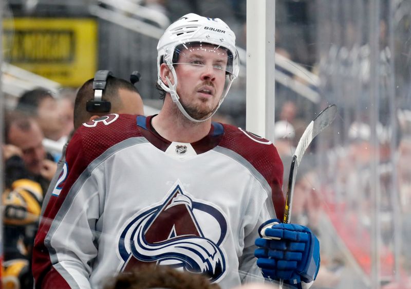 Oct 26, 2023; Pittsburgh, Pennsylvania, USA; Colorado Avalanche center Ryan Johansen (12) steps into the penalty box to serve a slashing penalty against the Pittsburgh Penguins during the third period at PPG Paints Arena. The Penguins shutout the Avalanche 4-0. Mandatory Credit: Charles LeClaire-USA TODAY Sports