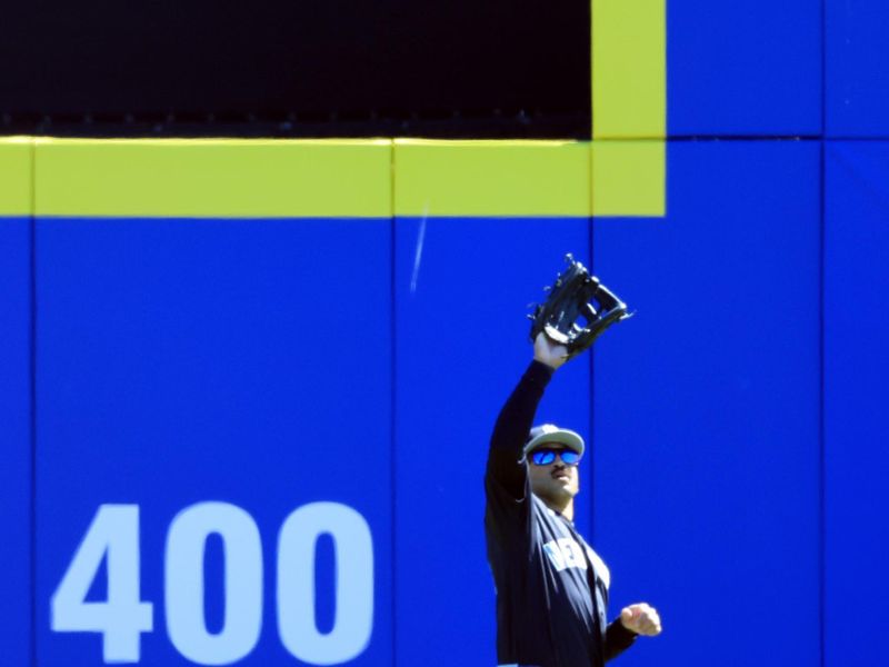 Feb 24, 2026; Dunedin, Florida, USA; New York Yankees center fielder Trent Grisham (12) catches a fly ball during the second inning against the Toronto Blue Jays at TD Ballpark. Mandatory Credit: Kim Klement Neitzel-Imagn Images