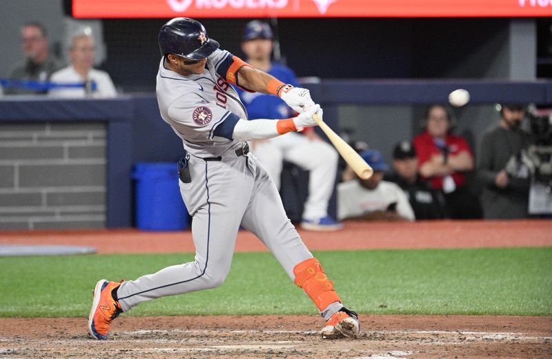 Jul 2, 2024; Toronto, Ontario, CAN;  Houston Astros shortstop Jeremy Pena (3) hits a double against the Toronto Blue Jays in the ninth inning at Rogers Centre. Mandatory Credit: Dan Hamilton-USA TODAY Sports