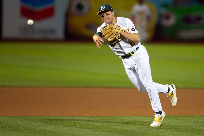 Aug 19, 2023; Oakland, California, USA; Oakland Athletics shortstop Nick Allen (2) throws home too late to get Baltimore Orioles first baseman Ryan Mountcastle (not pictured) out at home on a fielder   s choice ground ball during the 10th inning at Oakland-Alameda County Coliseum. Mandatory Credit: D. Ross Cameron-USA TODAY Sports