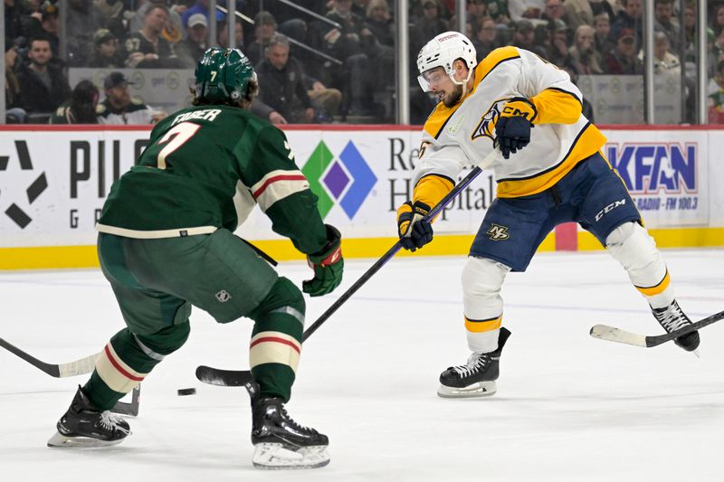 Jan 25, 2024; Saint Paul, Minnesota, USA; Nashville Predators defenseman Alexandre Carrier (45) takes a shot on goal against the Minnesota Wild during the first period at Xcel Energy Center. Mandatory Credit: Nick Wosika-USA TODAY Sports