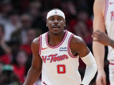 HOUSTON, TEXAS - DECEMBER 27: Aaron Holiday #0 of the Houston Rockets dribbles the ball during the third quarter of the game against the Phoenix Suns at Toyota Center on December 27, 2023 in Houston, Texas. User expressly acknowledges and agrees that, by downloading and or using this photograph, User is consenting to the terms and conditions of the Getty Images License Agreement. (Photo by Alex Bierens de Haan/Getty Images)