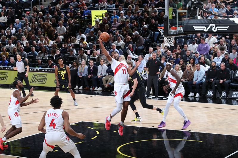 SALT LAKE CITY, UT - JANUARY 12: Jontay Porter #11 of the Toronto Raptors grabs the rebound during the game against the Utah Jazz on January 12, 2024 at Delta Center in Salt Lake City, Utah. NOTE TO USER: User expressly acknowledges and agrees that, by downloading and or using this Photograph, User is consenting to the terms and conditions of the Getty Images License Agreement. Mandatory Copyright Notice: Copyright 2024 NBAE (Photo by Melissa Majchrzak/NBAE via Getty Images)