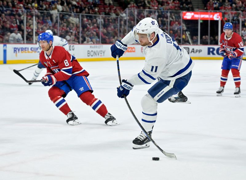 Mar 9, 2024; Montreal, Quebec, CAN: Toronto Maple Leafs forward Max Domi (11) takes a shot on the Montreal Canadiens net during the first period at the Bell Centre. Mandatory Credit: Eric Bolte-USA TODAY Sports