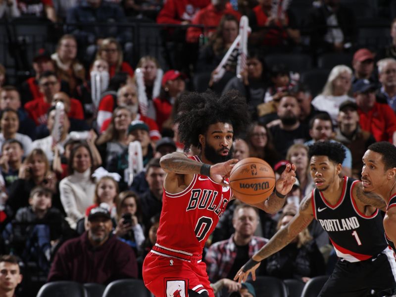 PORTLAND, OR - JANUARY 28: Coby White #0 of the Chicago Bulls passes the ball during the game against the Portland Trail Blazers on January 28, 2024 at the Moda Center Arena in Portland, Oregon. NOTE TO USER: User expressly acknowledges and agrees that, by downloading and or using this photograph, user is consenting to the terms and conditions of the Getty Images License Agreement. Mandatory Copyright Notice: Copyright 2024 NBAE (Photo by Cameron Browne/NBAE via Getty Images)