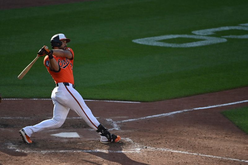 Jun 15, 2024; Baltimore, Maryland, USA;  Baltimore Orioles outfielder Anthony Santander (25) swings throw a two run home run against the Philadelphia Phillies in the eighth inning at Oriole Park at Camden Yards. Mandatory Credit: Tommy Gilligan-USA TODAY Sports