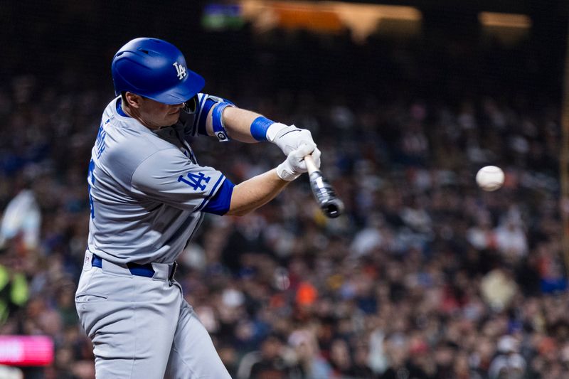 May 15, 2024; San Francisco, California, USA; Los Angeles Dodgers catcher Will Smith (16) hits a single against the San Francisco Giants during the eighth inning at Oracle Park. Mandatory Credit: John Hefti-USA TODAY Sports