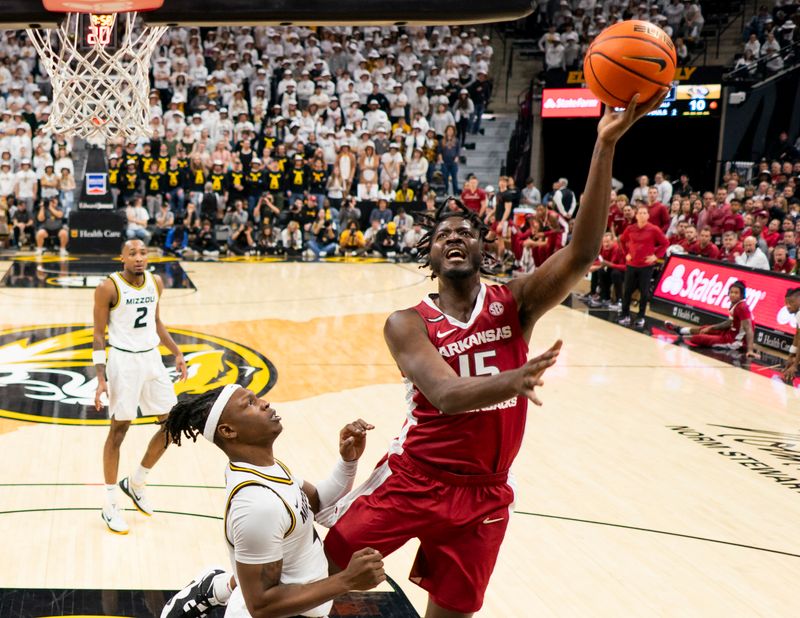 Jan 31, 2024; Columbia, Missouri, USA; Arkansas Razorbacks forward Makhi Mitchell (15) shoots against Missouri Tigers guard Anthony Robinson II (14) during the first half at Mizzou Arena. Mandatory Credit: Jay Biggerstaff-USA TODAY Sports