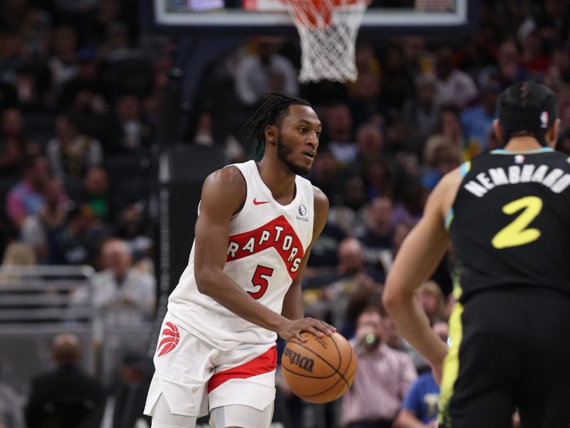 INDIANAPOLIS, IN - FEBRUARY 27: Immanuel Quickley #5 of the Toronto Raptors dribbles the ball during the game against the Indiana Pacers on February 27, 2024 at Gainbridge Fieldhouse in Indianapolis, Indiana. NOTE TO USER: User expressly acknowledges and agrees that, by downloading and or using this Photograph, user is consenting to the terms and conditions of the Getty Images License Agreement. Mandatory Copyright Notice: Copyright 2024 NBAE (Photo by Pepper Robinson/NBAE via Getty Images)