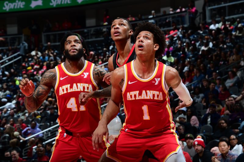 ATLANTA, GA - FEBRUARY 10: Jalen Johnson #1 and Saddiq Bey #41 of the Atlanta Hawks box out against Jabari Smith Jr. #10 of the Houston Rockets during the game on February 10, 2024 at State Farm Arena in Atlanta, Georgia.  NOTE TO USER: User expressly acknowledges and agrees that, by downloading and/or using this Photograph, user is consenting to the terms and conditions of the Getty Images License Agreement. Mandatory Copyright Notice: Copyright 2024 NBAE (Photo by Scott Cunningham/NBAE via Getty Images)