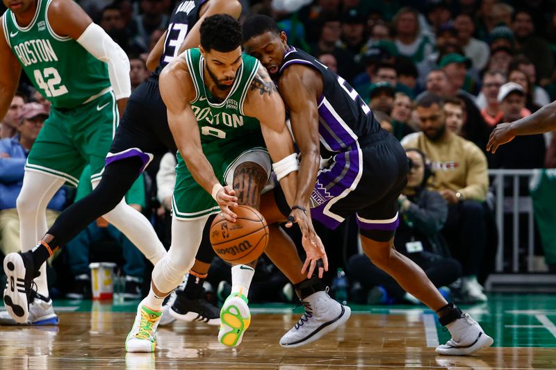 BOSTON, MA - APRIL 5: Jayson Tatum #0 of the Boston Celtics cuts in front of De'Aaron Fox #5 of the Sacramento Kings to grab a loose ball during the second quarter at TD Garden on April 5, 2024 in Boston, Massachusetts. NOTE TO USER: User expressly acknowledges and agrees that, by downloading and/or using this Photograph, user is consenting to the terms and conditions of the Getty Images License Agreement. (Photo By Winslow Townson/Getty Images)