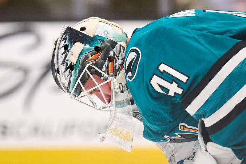 Oct 20, 2024; San Jose, California, USA; San Jose Sharks goaltender Vitek Vanecek (41) looks at the ice during a stoppage of play against the Colorado Avalanche during the third period at SAP Center at San Jose. Mandatory Credit: Robert Edwards-Imagn Images