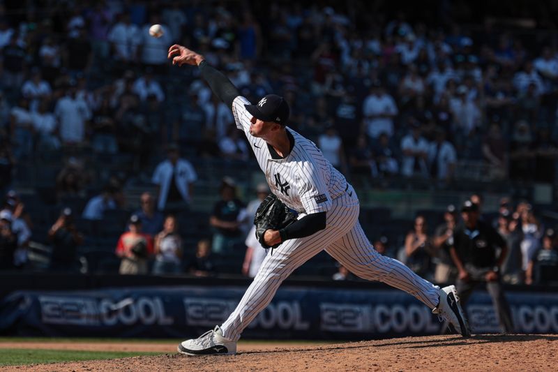 Aug 11, 2024; Bronx, New York, USA; New York Yankees relief pitcher Clay Holmes (35) delivers a pitch during the ninth inning against the Texas Rangers at Yankee Stadium. Mandatory Credit: Vincent Carchietta-USA TODAY Sports