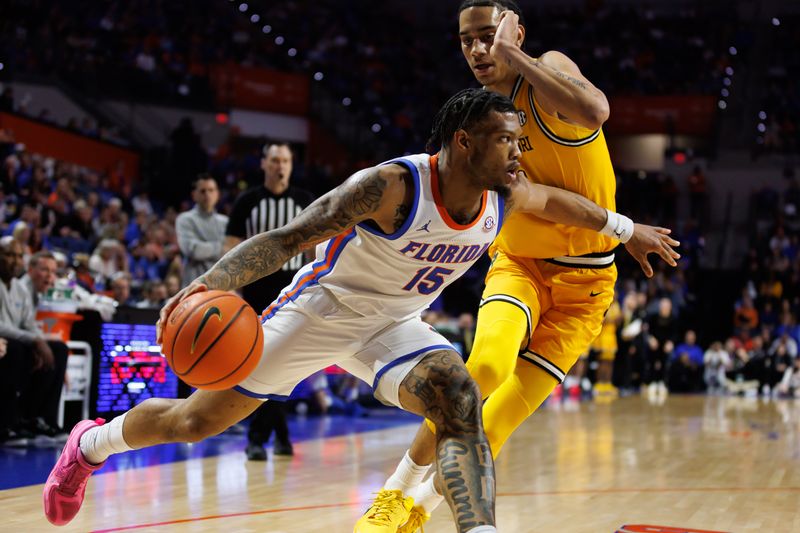 Jan 14, 2025; Gainesville, Florida, USA; Florida Gators guard Alijah Martin (15) drives to the basket past Missouri Tigers guard Trent Pierce (11) during the second half at Exactech Arena at the Stephen C. O'Connell Center. Mandatory Credit: Matt Pendleton-Imagn Images