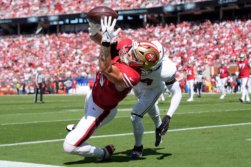 San Francisco 49ers tight end George Kittle, left, cannot catch a pass in the end zone while being defended by Arizona Cardinals safety Jalen Thompson during the first half of an NFL football game in Santa Clara, Calif., Sunday, Oct. 6, 2024. (AP Photo/Godofredo A. Vásquez)