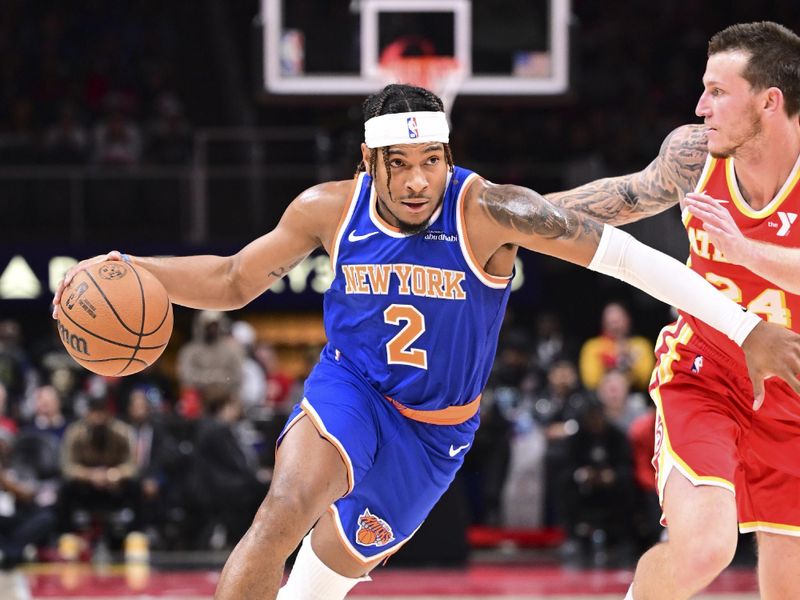 ATLANTA, GA - November 6:  Miles McBride #2 of the New York Knicks drives to the basket during the game against the Atlanta Hawks on November 6, 2024 at State Farm Arena in Atlanta, Georgia.  NOTE TO USER: User expressly acknowledges and agrees that, by downloading and/or using this Photograph, user is consenting to the terms and conditions of the Getty Images License Agreement. Mandatory Copyright Notice: Copyright 2024 NBAE (Photo by Adam Hagy/NBAE via Getty Images)