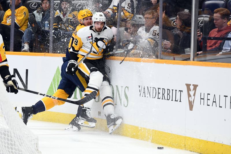 Nov 28, 2023; Nashville, Tennessee, USA; Pittsburgh Penguins defenseman Marcus Pettersson (28) avoids a hit by Nashville Predators right wing Michael McCarron (47) during the third period at Bridgestone Arena. Mandatory Credit: Christopher Hanewinckel-USA TODAY Sports