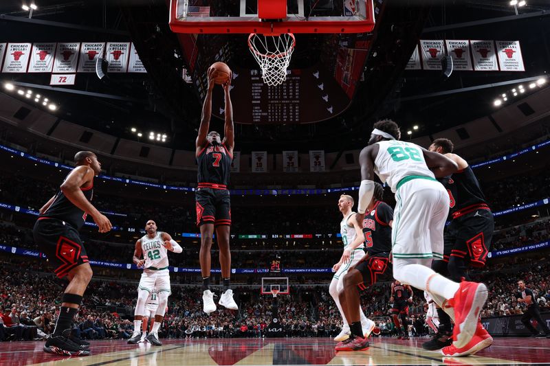 CHICAGO, IL - NOVEMBER 29: Jalen Smith #7 of the Chicago Bulls rebounds the ball during the game against the Boston Celtics during the Emirates NBA Cup game on November 29, 2024 at United Center in Chicago, Illinois. NOTE TO USER: User expressly acknowledges and agrees that, by downloading and or using this photograph, User is consenting to the terms and conditions of the Getty Images License Agreement. Mandatory Copyright Notice: Copyright 2024 NBAE (Photo by Jeff Haynes/NBAE via Getty Images)