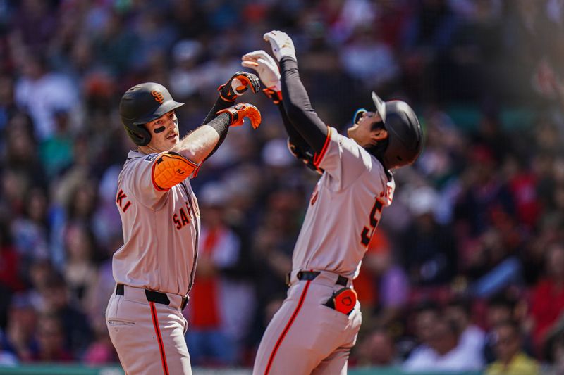 May 2, 2024; Boston, Massachusetts, USA; San Francisco Giants right fielder Mike Yastrzemski (5) is congratulated by center fielder Jung Hoo Lee (51) after hitting a home run against the Boston Red Sox in the third inning at Fenway Park. Mandatory Credit: David Butler II-USA TODAY Sports
