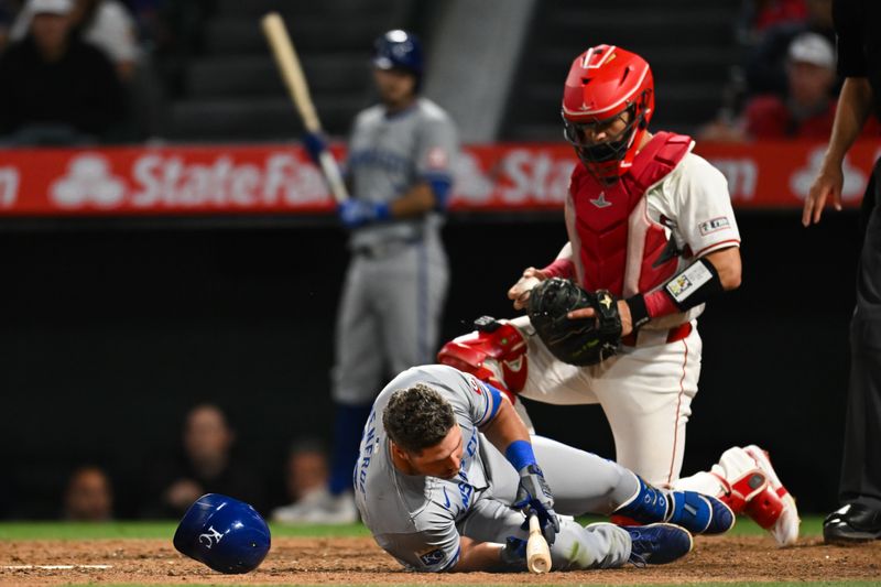 May 11, 2024; Anaheim, California, USA; Kansas City Royals outfielder Hunter Renfroe (16) hits the ground after dodging a pitch against the Los Angeles Angels during the ninth inning at Angel Stadium. Mandatory Credit: Jonathan Hui-USA TODAY Sports