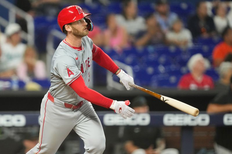 Apr 3, 2024; Miami, Florida, USA; Los Angeles Angels left fielder Taylor Ward (3) watches his home run leave the ballpark in the eight inning against the Miami Marlins at loanDepot Park. Mandatory Credit: Jim Rassol-USA TODAY Sports