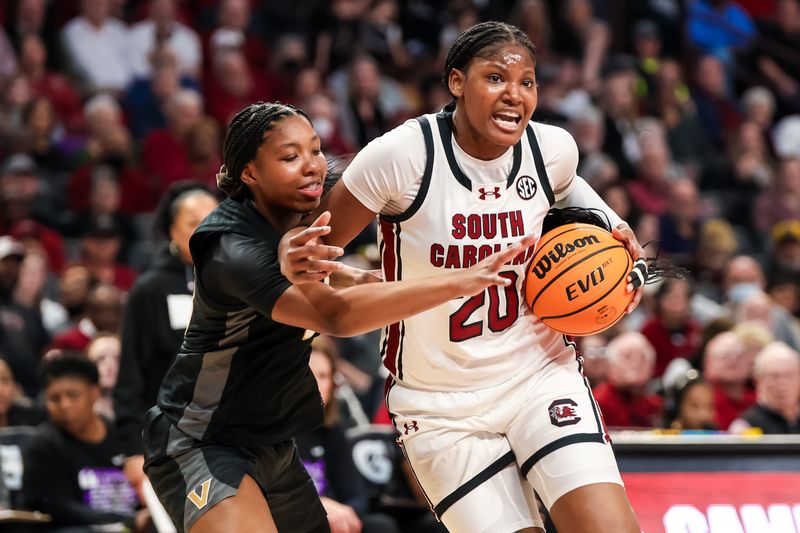 Jan 28, 2024; Columbia, South Carolina, USA; South Carolina Gamecocks forward Sania Feagin (20) drives past Vanderbilt Commodores guard Iyana Moore (23) in the second half at Colonial Life Arena. Mandatory Credit: Jeff Blake-USA TODAY Sports