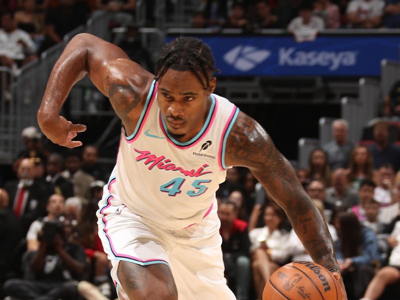 MIAMI, FL - FEBRUARY 10:  Davion Mitchell #45 of the Miami Heat dribbles the ball during the game against the Boston Celtics on February 10, 2025 at Kaseya Center in Miami, Florida. NOTE TO USER: User expressly acknowledges and agrees that, by downloading and or using this Photograph, user is consenting to the terms and conditions of the Getty Images License Agreement. Mandatory Copyright Notice: Copyright 2025 NBAE (Photo by Issac Baldizon/NBAE via Getty Images)