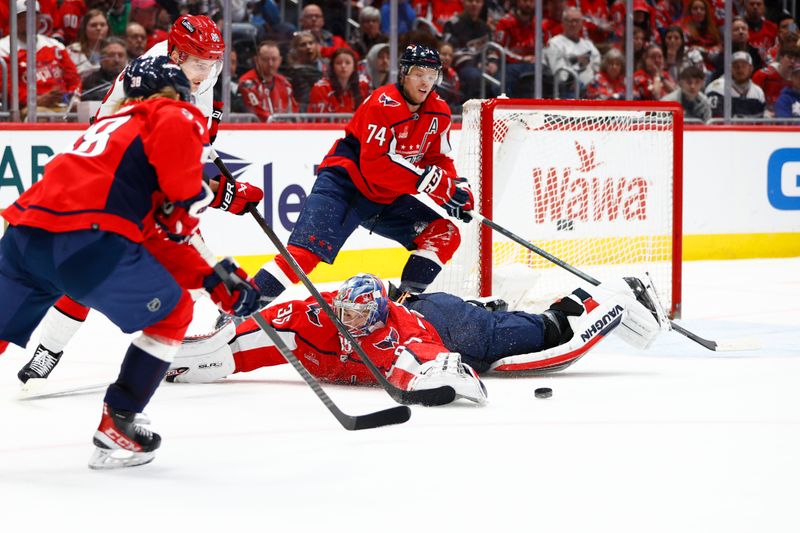 Mar 22, 2024; Washington, District of Columbia, USA; Washington Capitals goaltender Darcy Kuemper (35) makes a save against Carolina Hurricanes center Martin Necas (88) during the second period at Capital One Arena. Mandatory Credit: Amber Searls-USA TODAY Sports