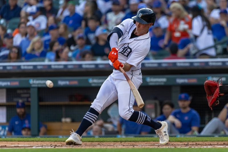 Aug 22, 2023; Detroit, Michigan, USA; Detroit Tigers right fielder Kerry Carpenter (30) hits an RBI single in the first inning against the Chicago Cubs at Comerica Park. Mandatory Credit: David Reginek-USA TODAY Sports