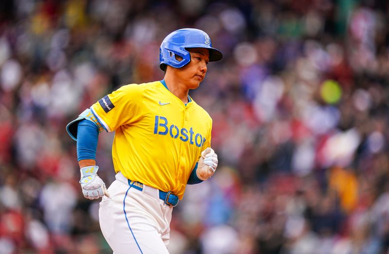 Apr 14, 2024; Boston, Massachusetts, USA; Boston Red Sox left fielder Masataka Yoshida (7) rounds the bases after hitting a two run home run against the Los Angeles Angels in the sixth inning at Fenway Park. Mandatory Credit: David Butler II-USA TODAY Sports