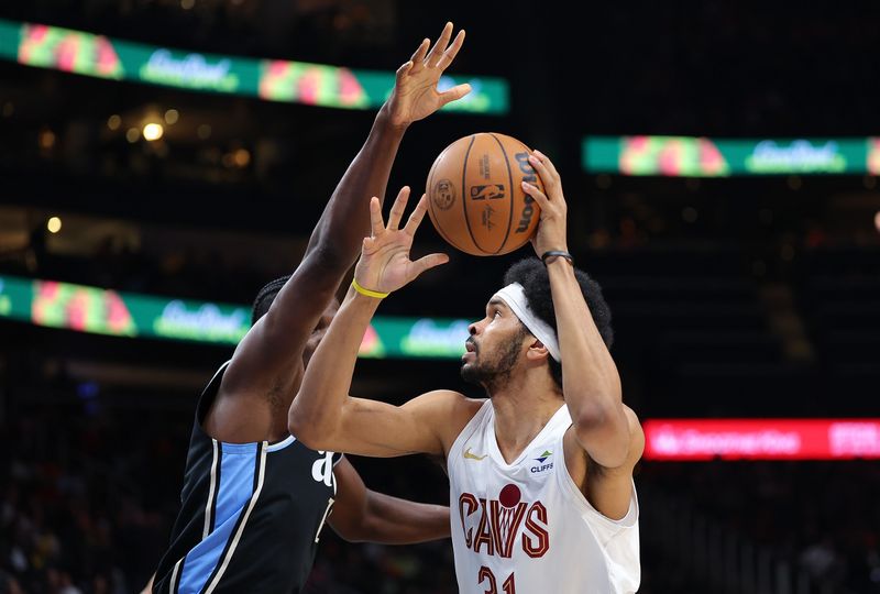 ATLANTA, GEORGIA - MARCH 06:  Jarrett Allen #31 of the Cleveland Cavaliers attacks the basket against Clint Capela #15 of the Atlanta Hawks during the first quarter at State Farm Arena on March 06, 2024 in Atlanta, Georgia.  NOTE TO USER: User expressly acknowledges and agrees that, by downloading and/or using this photograph, user is consenting to the terms and conditions of the Getty Images License Agreement.  (Photo by Kevin C. Cox/Getty Images)