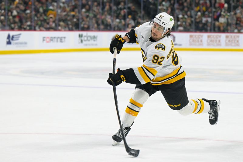 Dec 14, 2025; Saint Paul, Minnesota, USA;  Boston Bruins forward Marat Khusnutdinov (92) shoots the puck against the Minnesota Wild during the first period at Grand Casino Arena. Mandatory Credit: Nick Wosika-Imagn Images
