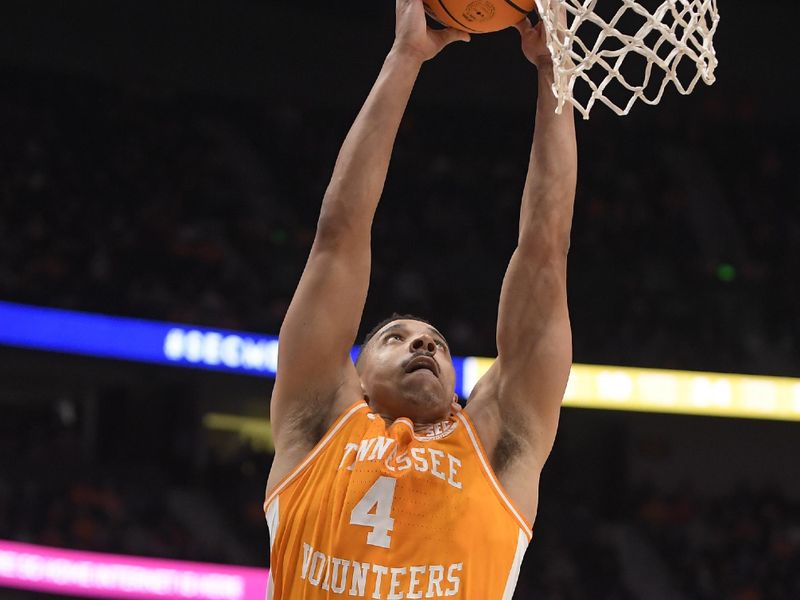 Mar 10, 2023; Nashville, TN, USA;  Tennessee Volunteers guard Tyreke Key (4) slams the ball against the Missouri Tigers during the first half at Bridgestone Arena. Mandatory Credit: Steve Roberts-USA TODAY Sports