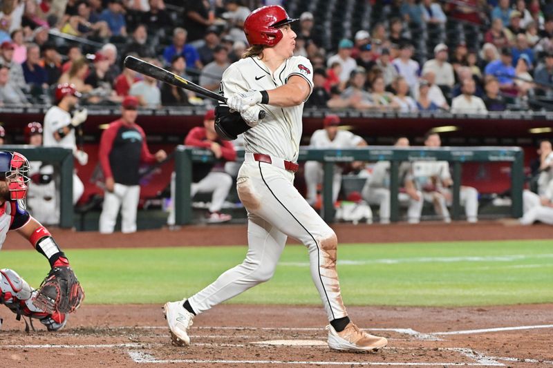 Jul 31, 2024; Phoenix, Arizona, USA;  Arizona Diamondbacks outfielder Jake McCarthy (31) triples against the Washington Nationals in the third inning at Chase Field. Mandatory Credit: Matt Kartozian-USA TODAY Sports