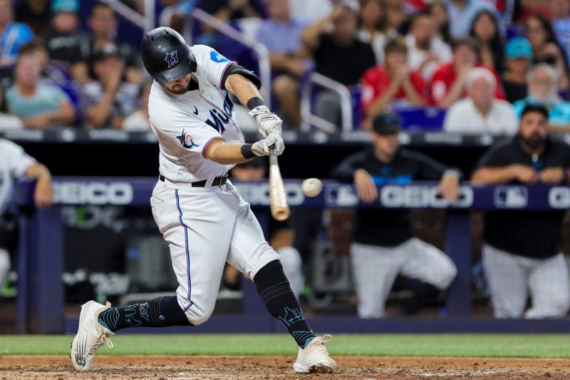 Jul 30, 2023; Miami, Florida, USA; Miami Marlins center fielder Garrett Hampson (1) hits a two-run double against the Detroit Tigers during the fifth inning at loanDepot Park. Mandatory Credit: Sam Navarro-USA TODAY Sports