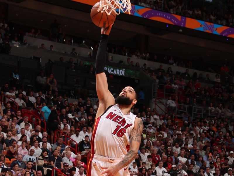 MIAMI, FL - APRIL 19: Caleb Martin #16 of the Miami Heat grabs the rebound during the game against the Chicago Bulls during the 2024 Play-In Tournament on April 19, 2024 at Kaseya Center in Miami, Florida. NOTE TO USER: User expressly acknowledges and agrees that, by downloading and or using this Photograph, user is consenting to the terms and conditions of the Getty Images License Agreement. Mandatory Copyright Notice: Copyright 2024 NBAE (Photo by Issac Baldizon/NBAE via Getty Images)