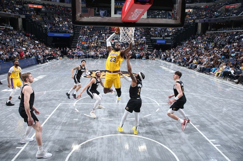 MEMPHIS, TN - APRIL 12: LeBron James #23 of the Los Angeles Lakers dunks the ball during the game against the Memphis Grizzlies on April 12, 2024 at FedExForum in Memphis, Tennessee. NOTE TO USER: User expressly acknowledges and agrees that, by downloading and or using this photograph, User is consenting to the terms and conditions of the Getty Images License Agreement. Mandatory Copyright Notice: Copyright 2024 NBAE (Photo by Joe Murphy/NBAE via Getty Images)