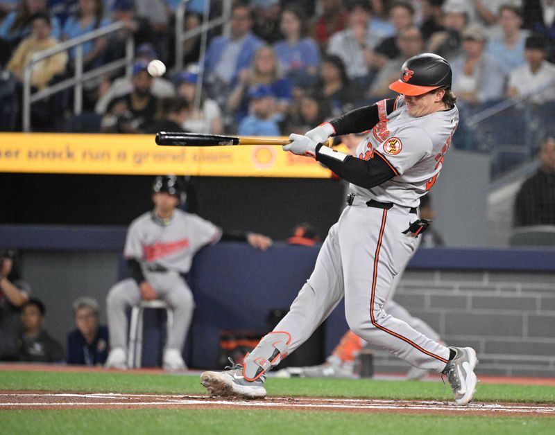  Jun 5, 2024; Toronto, Ontario, CAN;   Baltimore Orioles catcher Adley Rutschman (35) hits a single against the Toronto Blue Jays in the first inning at Rogers Centre. Mandatory Credit: Dan Hamilton-USA TODAY Sports 