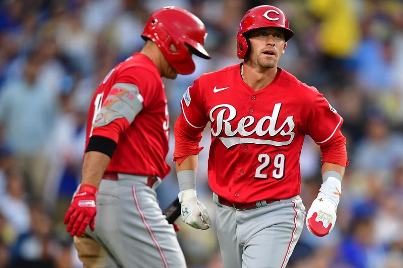 Jul 29, 2023; Los Angeles, California, USA; Cincinnati Reds center fielder TJ Friedl (29) is greeted by first baseman Joey Votto (19) after scoring a run against the Los Angeles Dodgers during the sixth inning at Dodger Stadium. Mandatory Credit: Gary A. Vasquez-USA TODAY Sports