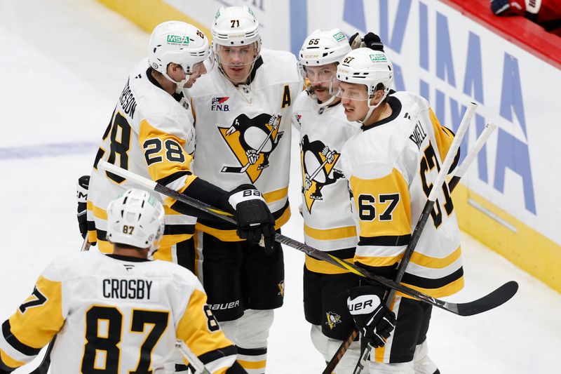 Nov 8, 2024; Washington, District of Columbia, USA; Pittsburgh Penguins defenseman Erik Karlsson (65) celebrates with teammates after scoring a goal against the Washington Capitals in the first period at Capital One Arena. Mandatory Credit: Geoff Burke-Imagn Images