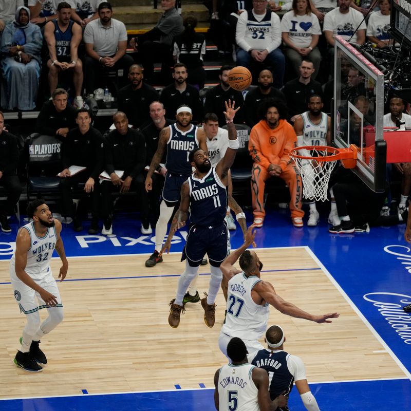 MINNEAPOLIS, MN -  MAY 22: Kyrie Irving #11 of the Dallas Mavericks drives to the basket during the game  against the Minnesota Timberwolves during Game 1 of the Western Conference Finals of the 2024 NBA Playoffs on January 1, 2024 at Target Center in Minneapolis, Minnesota. NOTE TO USER: User expressly acknowledges and agrees that, by downloading and or using this Photograph, user is consenting to the terms and conditions of the Getty Images License Agreement. Mandatory Copyright Notice: Copyright 2024 NBAE (Photo by Jordan Johnson/NBAE via Getty Images)