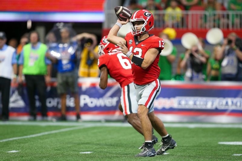 Sep 3, 2022; Atlanta, Georgia, USA; Georgia Bulldogs quarterback Stetson Bennett (13) throws a pass against the Oregon Ducks in the first quarter at Mercedes-Benz Stadium. Mandatory Credit: Brett Davis-USA TODAY Sports
