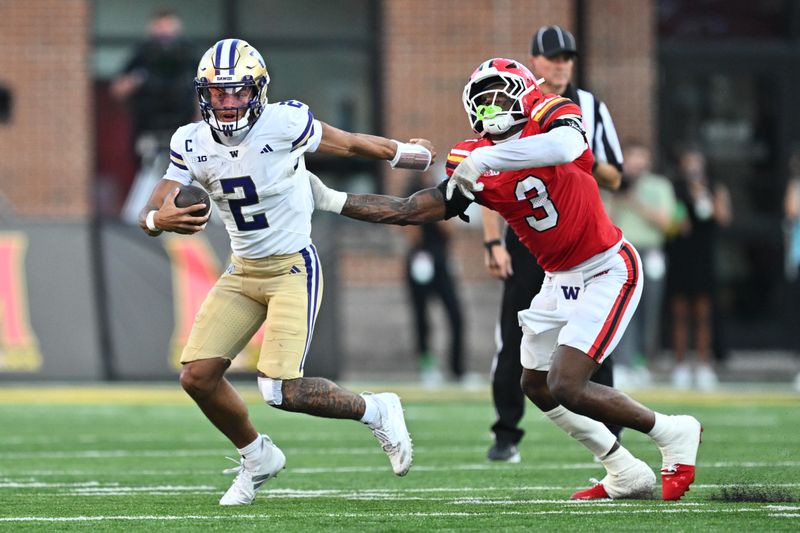 Oct 4, 2025; College Park, Maryland, USA;  Washington Huskies quarterback Demond Williams Jr. (2) eludes the grasp of Maryland Terrapins linebacker Trey Reddick (3) in the second half at SECU Stadium. Mandatory Credit: Jamie Sabau-Imagn Images