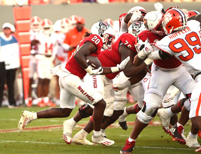 Oct 28, 2023; Raleigh, North Carolina, USA; North Carolina State Wolfpack running back Kendrick Raphael (20) runs the ball during the second half against the Clemson Tigers at Carter-Finley Stadium. Mandatory Credit: Rob Kinnan-USA TODAY Sports