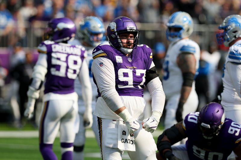 Minnesota Vikings defensive tackle Harrison Phillips (97) reacts after stopping the ball against the Detroit Lions during the first half of an NFL football game Sunday, Oct. 20, 2024 in Minneapolis. (AP Photo/Stacy Bengs)