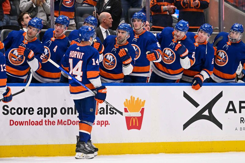 Feb 8, 2024; Elmont, New York, USA; New York Islanders center Bo Horvat (14) celebrates his goal with the New York Islanders against the Tampa Bay Lightning during the second period at UBS Arena. Mandatory Credit: Dennis Schneidler-USA TODAY Sports