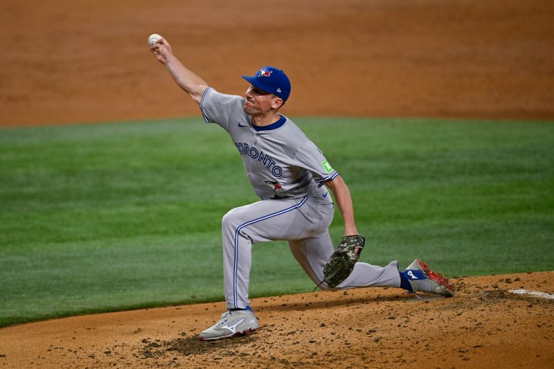 Sep 17, 2024; Arlington, Texas, USA; Toronto Blue Jays starting pitcher Chris Bassitt (40) pitches against the Texas Rangers during the first inning at Globe Life Field. Mandatory Credit: Jerome Miron-Imagn Images