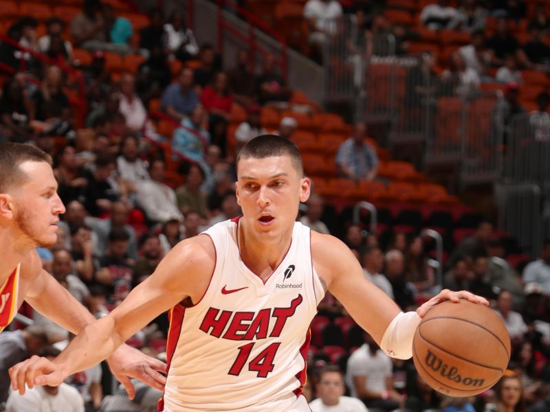 MIAMI, FL - OCTOBER 16: Tyler Herro #14 of the Miami Heat dribbles the ball during the game against the Atlanta Hawks  on October 16, 2024 at Miami-Dade Arena in Miami, Florida. NOTE TO USER: User expressly acknowledges and agrees that, by downloading and or using this Photograph, user is consenting to the terms and conditions of the Getty Images License Agreement. Mandatory Copyright Notice: Copyright 2024 NBAE (Photo by Issac Baldizon/NBAE via Getty Images)