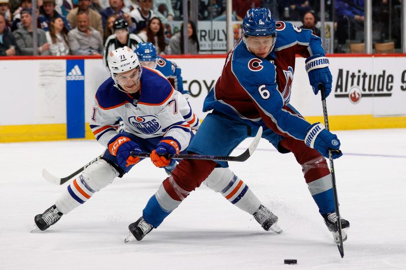 Apr 11, 2023; Denver, Colorado, USA; Colorado Avalanche defenseman Erik Johnson (6) controls the puck ahead of Edmonton Oilers center Ryan McLeod (71) in the second period at Ball Arena. Mandatory Credit: Isaiah J. Downing-USA TODAY Sports